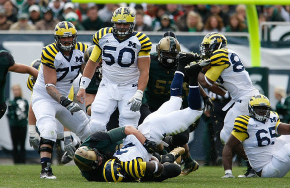 Taylor Lewan (77), Vincent Smith (2), David Molk (50), Kevin Koger (86), and Patrick Omameh (65)