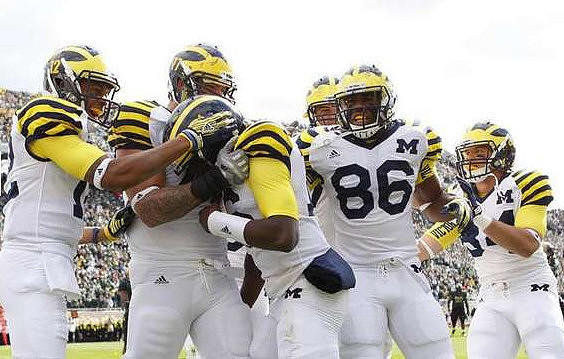 Roy Roundtree (12), Taylor Lewan (77), Denard Robinson (16), Kevin Koger (86), and Steve Watson (84)