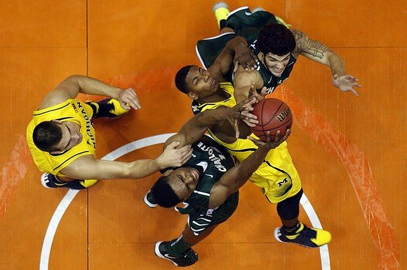 Mitch McGary (4) and Glenn Robinson III (1)