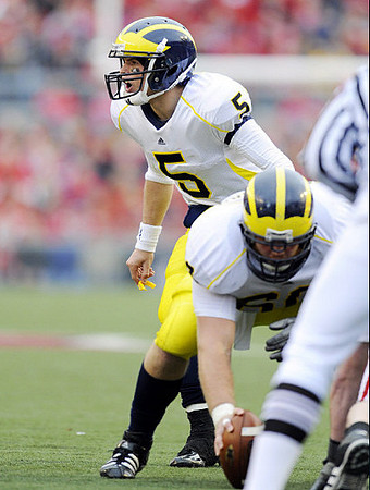 Tate Forcier (5) and David Moosman (60)