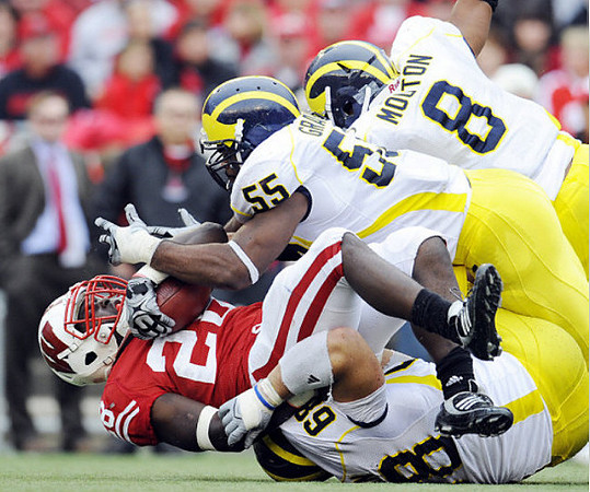Mike Martin (68), Brandon Graham (55), and Jonas Mouton (8)