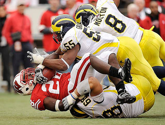 Mike Martin (68), Brandon Graham (55), and Jonas Mouton (8)