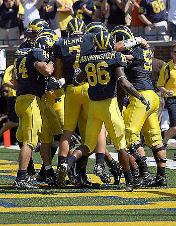 Mark Moundros, Chad Henne, Mario Manningham, and Stephen Schilling