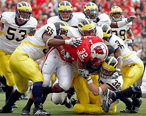 Ryan Van Bergen (53), Brandon Graham (55), Mike Martin (68), Jordan Kovacs (32), Stevie Brown (3), and Troy Woolfolk (29)