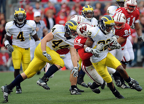 Brandon Smith (4), Mark Moundros (44), and Darryl Stonum (22)