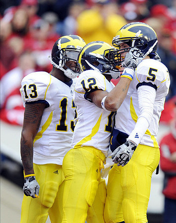Greg Mathews (13), Roy Roundtree (12), and Tate Forcier (5)