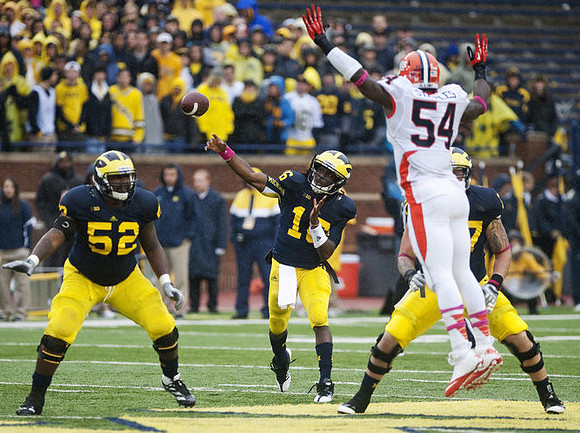 Ricky Barnum (52), Denard Robinson (16), and Taylor Lewan (77)