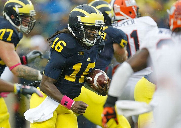 Taylor Lewan (77), Denard Robinson (16), and Michael Schofield (75)