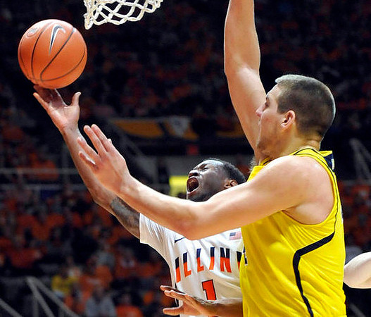 Spike Albrecht (2), John Beilein, and Caris LeVert (23)