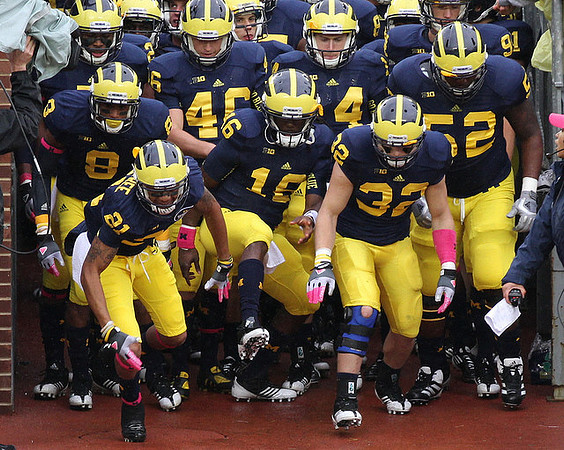 J.T. Floyd (8), Roy Roundtree (21), Denard Robinson (16), Seth Broekhuizen (46), Jack Kennedy (14), Jordan Kovacs (32), and Ricky Barnum (52)