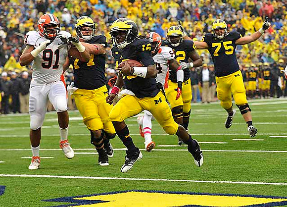 Taylor Lewan (77), Denard Robinson (16), Ricky Barnum (52), and Michael Schofield (75)