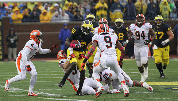 Devin Gardner (12), Fitzgerald Toussaint (28), and Elliott Mealer (57)