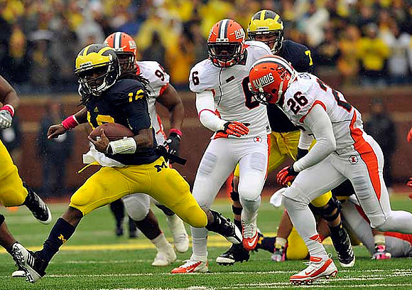 Denard Robinson (16) and Michael Schofield (75)