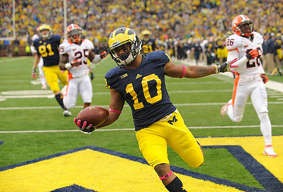 Mike Kwiatkowski (81) and Jeremy Gallon (10)