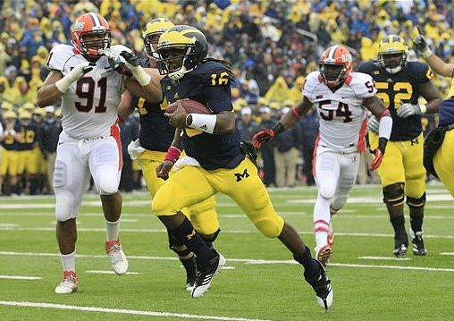 Denard Robinson (16), Taylor Lewan (77), and Ricky Barnum (52)