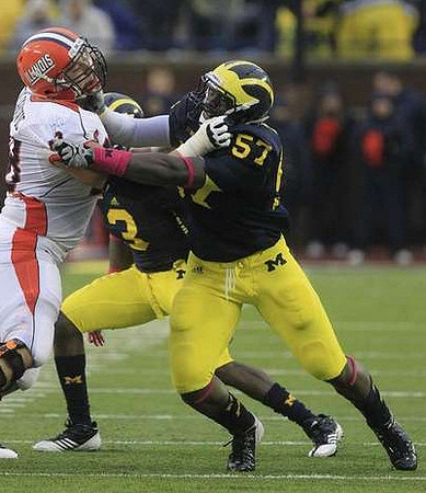 Marvin Robinson (3) and Frank Clark (57)