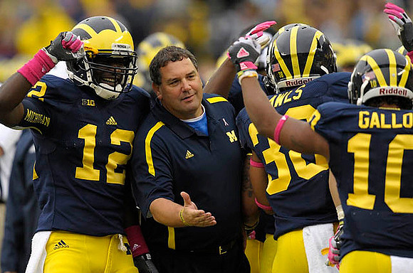 Devin Gardner (12), Brady Hoke, Thomas Rawls (38), and Jeremy Gallon (10)