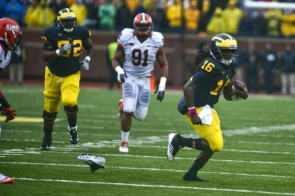Ricky Barnum (52) and Denard Robinson (16)