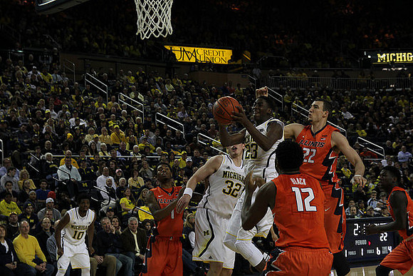 Derrick Walton Jr. (10), Ricky Doyle (32), and Caris LeVert (23)