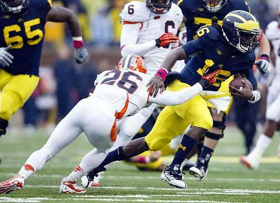 Patrick Omameh (65), Michael Schofield (75), and Denard Robinson (16)