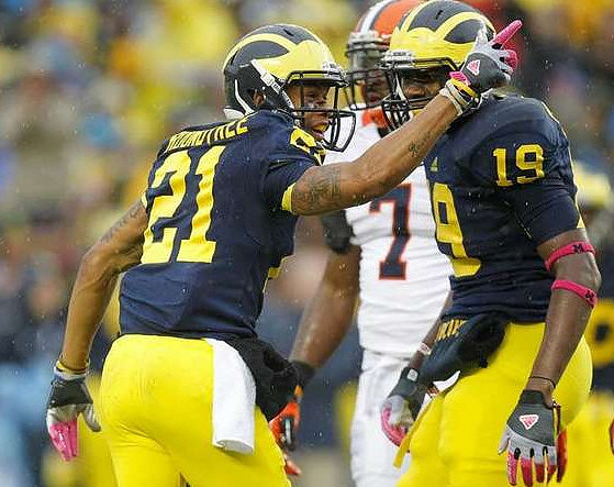 Roy Roundtree (21) and Devin Funchess (19)