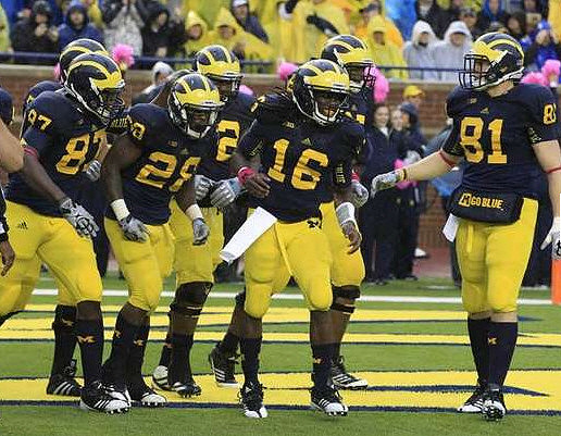 Brandon Moore (87), Fitzgerald Toussaint (28), Ricky Barnum (52), Denard Robinson (16), and ), and Mike Kwiatkowski (81)