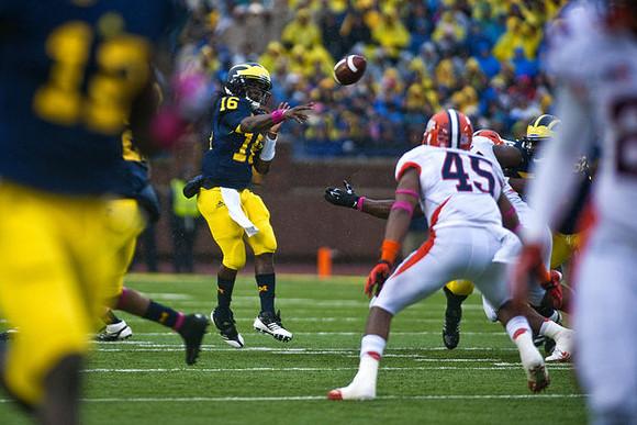 Denard Robinson (16) and Devin Gardner (12)