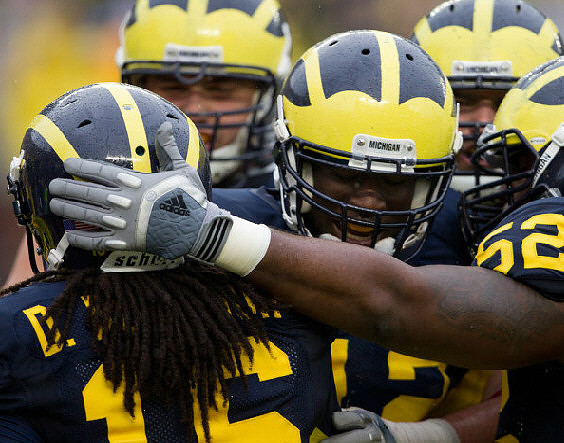 Denard Robinson (16), Devin Gardner (12),  and Ricky Barnum (52)