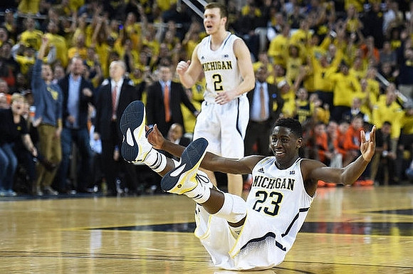 Spike Albrecht (2) and Caris LeVert (23)