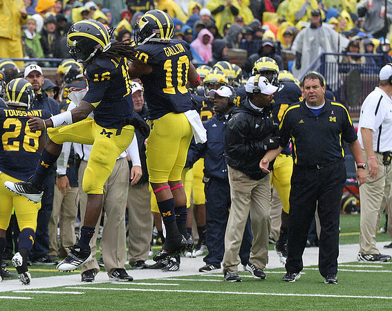 Fitzgerald Toussaint (28), Denard Robinson (16), Jeremy Gallon (10), Fred Jackson, and Brady Hoke