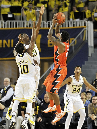 Derrick Walton Jr. (10), Caris LeVert (23), and Aubrey Dawkins (24)