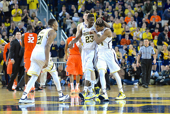 Zak Irvin (21), Caris LeVert (23), and Aubrey Dawkins (24)