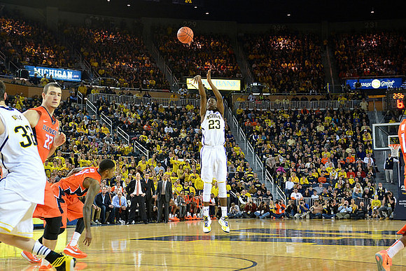 Ricky Doyle (32) and Caris LeVert (23)