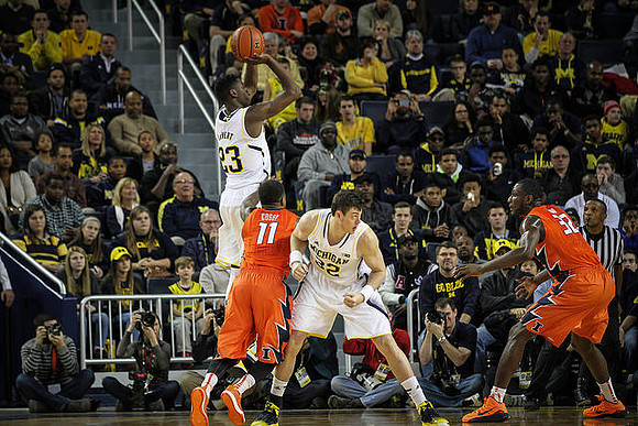 Caris LeVert (23) and Ricky Doyle (32)