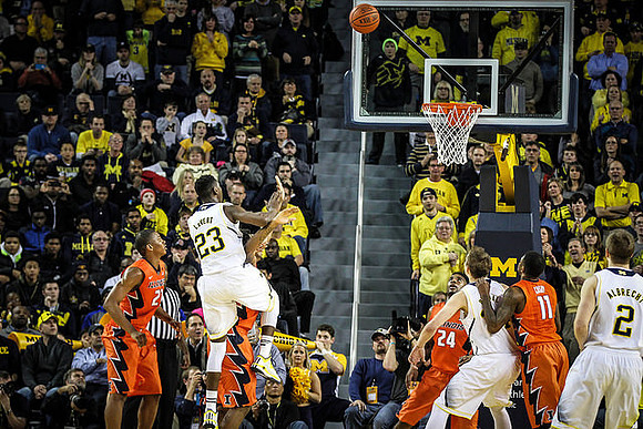 Caris LeVert (23), Mark Donnal (34), and Spike Albrecht (2)
