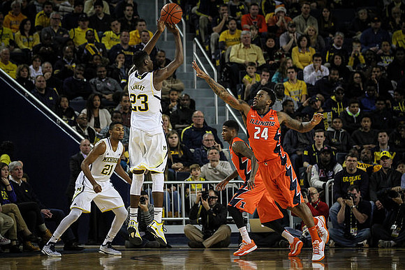 Zak Irvin (21) and Caris LeVert (23)