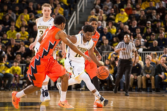 Mark Donnal (34) and Derrick Walton Jr. (10)