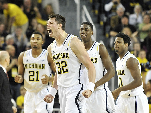 Zak Irvin (21), Ricky Doyle (32), Caris LeVert (23), and Derrick Walton Jr. (10)