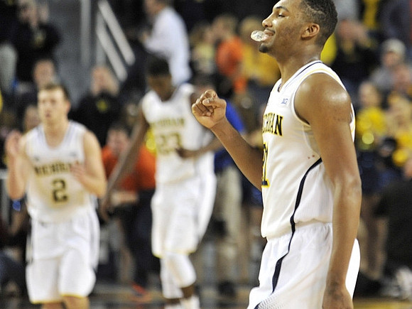 Spike Albrecht (2), Caris LeVert (23), and Zak Irvin (21)