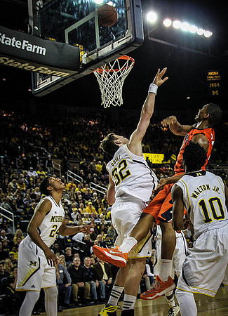 Aubrey Dawkins (24), Ricky Doyle (32), and Derrick Walton Jr. (10)