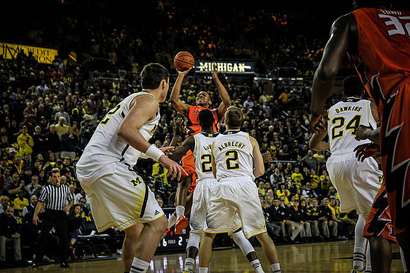 Ricky Doyle (32), Caris LeVert (23), Spike Albrecht (2), and Aubrey Dawkins (24)