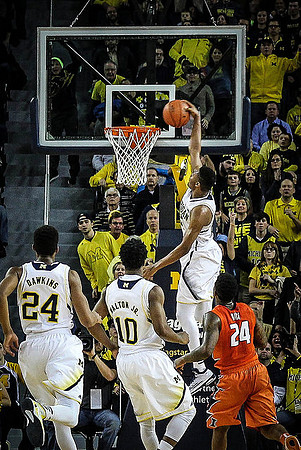Aubrey Dawkins (24), Derrick Walton Jr. (10), and Zak Irvin (21)