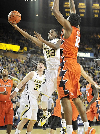 Ricky Doyle (32) and Caris LeVert (23)