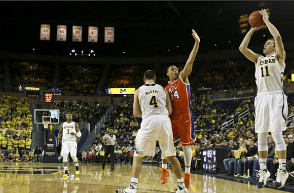 Glenn Robinson III (1), Mitch McGary (4), and Nik Stauskas (11)