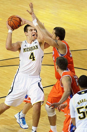 Mitch McGary (4) and Jordan Morgan (52)