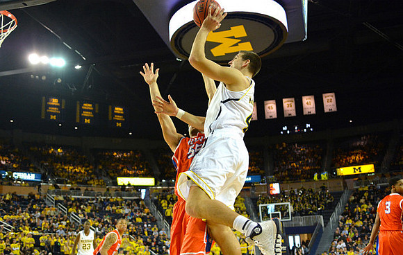 Caris LeVert (23) and Mitch McGary (4)