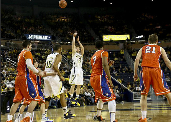 Jon Horford (15) and Spike Albrecht (2)