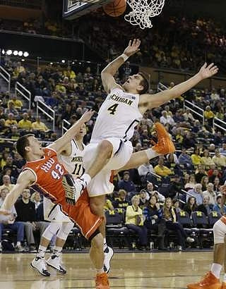Mitch McGary (4) and Nik Stauskas (11)