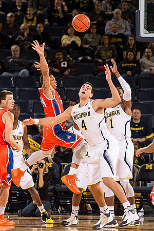 Caris LeVert (23), Mitch McGary (4), and Glenn Robinson III (1)