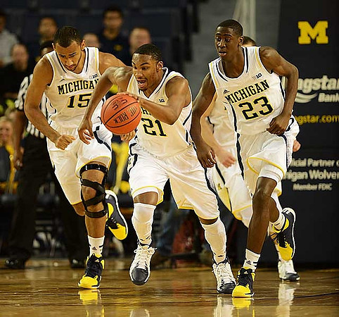 Jon Horford (15), Zak Irvin (21), and Caris LeVert (23)
